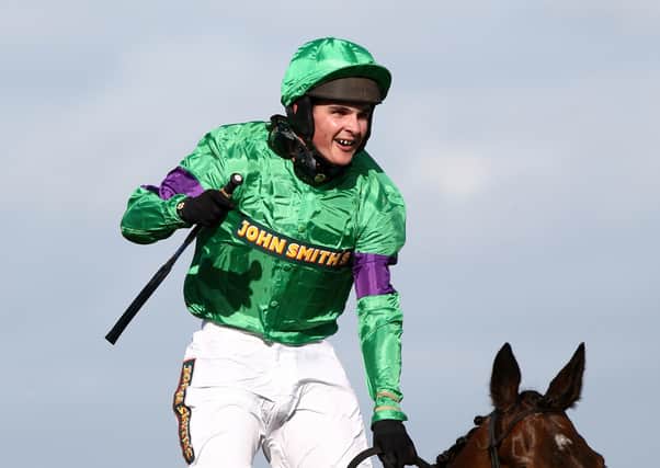 This was Liam Treadwell passing the Aintree winning post after winning the 2009 Grand National on Mon Mome.