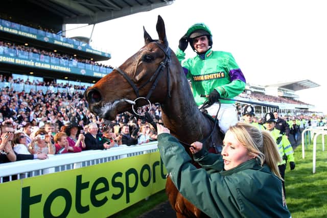 Liam Treadwell and Mon Mome return to the Aintree winner's enclosure.