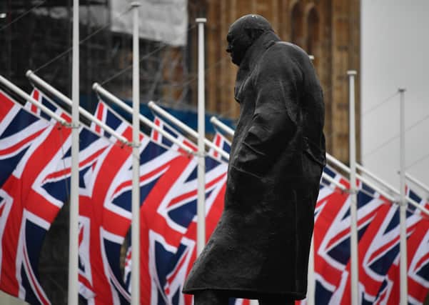 British flags by the statue in Parliament Square to Sir Winston Churchill - Britain is due to leave the EU on December 31, 2020, with or without a trade deal.