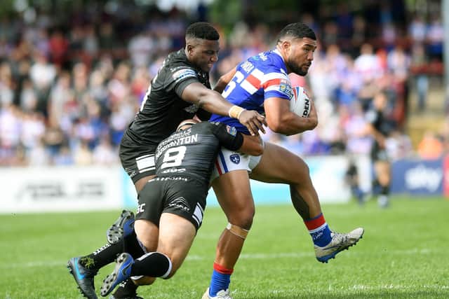 Betfred Super League.
Wakefield Trinity v Hull FC.
Wakefield's Kelepi Tanginoa is tackled by Hull's Danny Houghton and Masi Matongo.
11th July 2019.
Picture Jonathan Gawthorpe