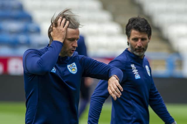 Plenty to ponder: Huddersfield Town's  Nicky and Danny Cowley after defeat by Wigan. Picture: Tony Johnson