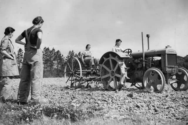 7th September 1939:  Recruits to the Women's Land Army learning to drive a tractor plough on a farm in Kent.  (Photo by Keystone/Getty Images)
