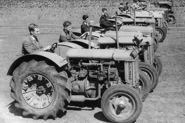 6th August 1940:  A line of tractors driven by trainees at the Oxford Institute of Agricultural Engineering. The Ministry of Agriculture has begun training boys between school-leaving and military ages, as well as several classes for agricultural workers.  (Photo by William Vanderson/Fox Photos/Getty Images)
