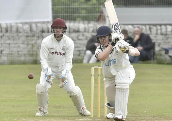 Flashback: action from last season's Bradford League  Priestley Cup final at Undercliffe with New Farnley opener Adam Waite on his way to 97 not out, watched by Woodlands wicketkeeper Greg Finn. Picture: Steve Riding