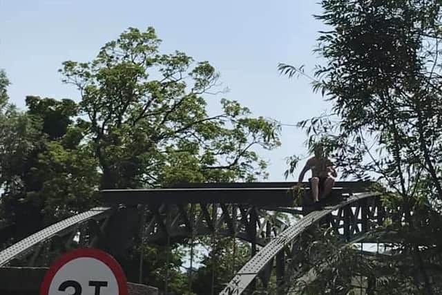 A tombstoner pictured at the top of the Swing Bridge