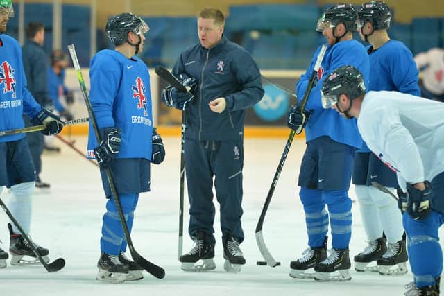 BIG CHANCE: Brendan Connolly, second left, chats with GB head coach PEte Russell in practice ahead of this year's Olympic Qualifiers in Nottingham. Picture: Dean Woolley.