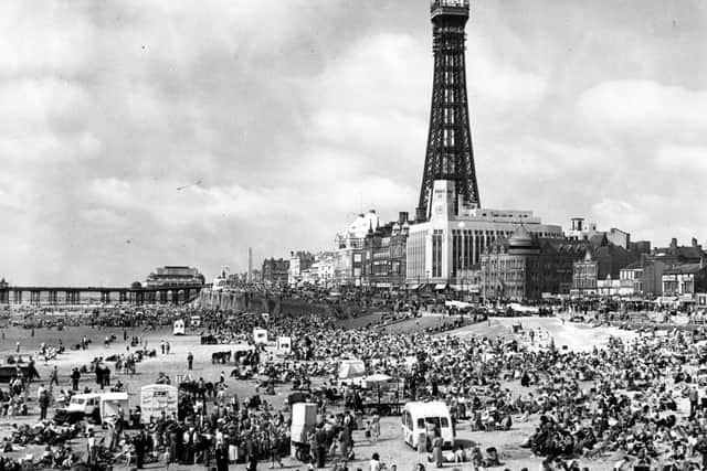 18th July 1951:  Crowds of holiday-makers on the beach at Blackpool, Lancashire, dominated by the Blackpool Tower.  (Photo by Fox Photos/Getty Images)