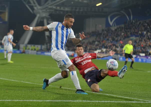 Huddersfield Town's Danny Simpson battles with Middlesbrough's Marvin Johnson. Picture Tony Johnson