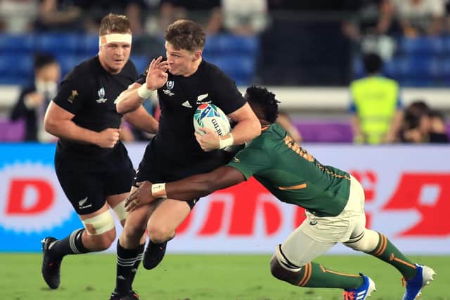 New Zealand's Beauden Barrett (centre) breaks clear during the 2019 Rugby World Cup Pool B match at International Stadium Yokohama, Yokohama City. PA Photo. Picture date: Saturday September 21, 2019. See PA story RUGBYU New Zealand. Photo credit should read: Adam Davy/PA Wire. RESTRICTIONS: Editorial use only. Strictly no commercial use or association. Still image use only. Use implies acceptance of RWC 2019 T&Cs (in particular Section 5 of RWC 2019 T&Cs) at: https://bit.ly/2knOId6