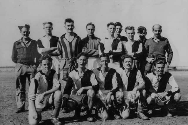 Sydney Mould right on the front row in December 1942 with the Ancillary Rovers football team.