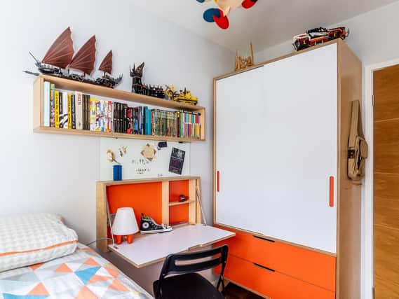 The room is tiny but Jim made the most of the space with a bed that includes storage with a truckle bed underneath and there is a matching fold-down desk and wardrobe all by Wood and Wire.