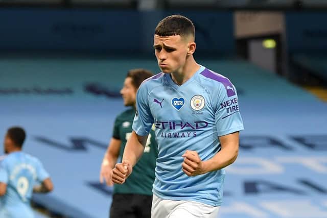 Manchester City's Phil Foden celebrates scoring his side's fifth goal against Burnley (Picture: PA)