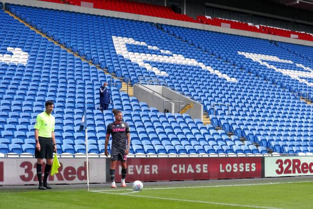 Leeds United's Kalvin Phillips prepares to take a corner at an empty Cardiff City Stadium..