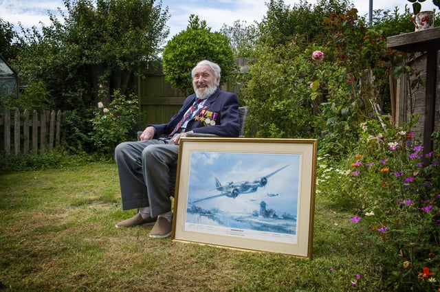 Sydney Mould with a picture of one of the Blenheim bombers he used to fly. Picture: Tony Johnson