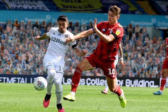 Match-turner: Pablo Hernandez is challenged by Tom Cairney.
