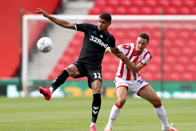 Eye on the ball: Middlesbrough's Ashley Fletcher and Stoke City's James Chester. Picture: PA