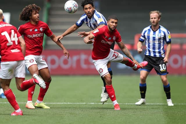 BATTLING: Bristol City's Nahki Wells and Sheffield Wednesday's Massimo Luongo challenge for the ball. Picture: David Davies/PA Wire.