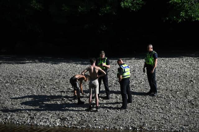 Police clear youths from the Ilkley pebble beaches