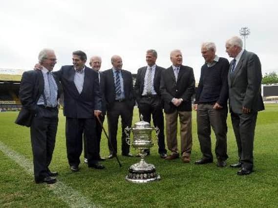 Barry Simms, left, took part in a reunion of the 1961 Championship team in 2011. Also pictured are (left to right) Wilf Rosenberg, Joe Warham (manager), Lewis Jones, Fred Pickup, Derek Hallas, Ken Thornett and Don Robinson. Picture by Tony Johnson.