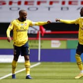 Nicolas Pepe (right) celebrates his goal with Alexandre Lacazette. Picture: Andrew Boyers/NMC Pool/PA Wire.