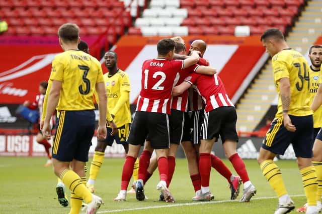 DISALLOWED: Sheffield United players celebrate after they thought they had taken the lead before Lundstram's goal was chalked off for offside. Picture: Andrew Boyers/NMC Pool/PA Wire.
