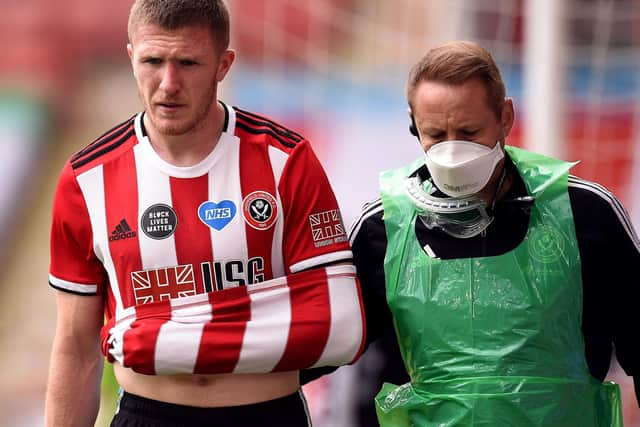INJURY: Lundstram was forced off midway through the first half. Picture: Oli Scarff/NMC Pool/PA Wire.