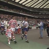 25 May 1996 - Bath and Wigan teams walking out with Wigan's mascot before the Rugby Union match of the clash of the codes,  held at Twickenham, London. Bath won  44-19.  (Picture: Mike  Hewitt/Allsport)