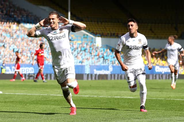 Leeds United's Ezgjan Alioski (left) celebrates scoring his side's second goal against Fulham (Picture: PA)