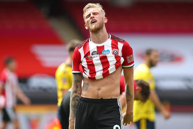 Oli McBurnie: Cut a dejected figure at the final whistle as Sheffield United lost to Arsenal. (Picture: SportImage)