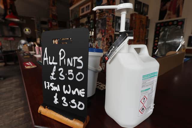 Alcohol hand gel provided for customers at the bar of Charrington's Noted Ales And Stout pub in London, as further coronavirus lockdown restrictions are lifted in England. Picture: Yui Mok/PA Wire