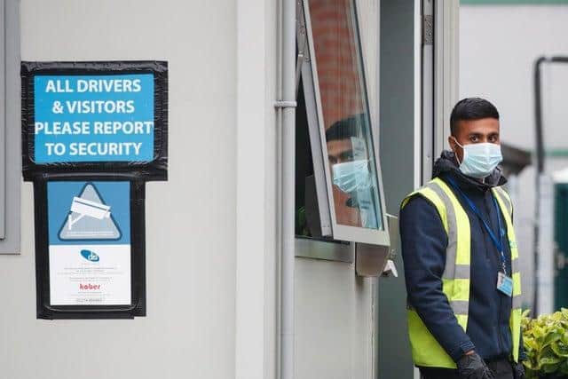 A security guard at Kober meat processing plant in Cleckheaton, that was confirmed as the location of a localised coronavirus outbreak, in Cleckheaton, West Yorkshire. Photo: PA