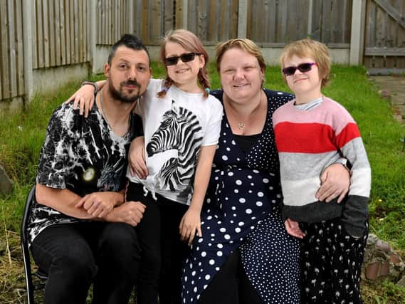 Emily Atkinson is pictured (second from left) with dad Darren Atkinson, mum  Jessica Kemp and sister Poppy-Mae.
Picture: Simon Hulme