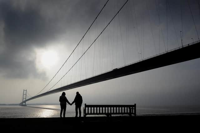 A couple look at The Humber Bridge, Hull..(Tech Data Nikon D3s camera, 12-24mm lens, Exposure 400th sec at f5.6, iso 200).5th November 2018 ..Picture by Simon Hulme