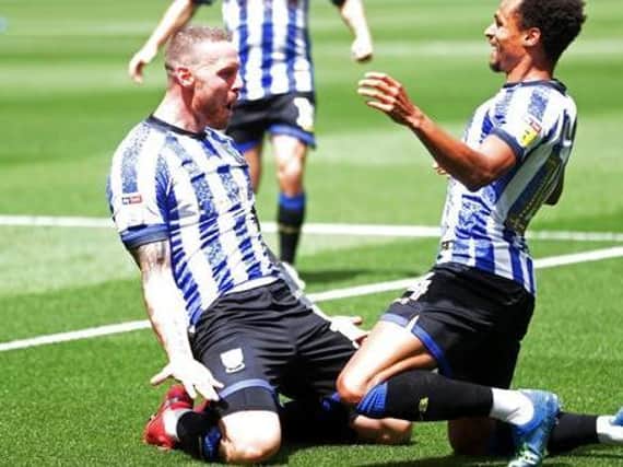 Sheffield Wednesday striker Connor Wickham celebrates with fellow loanee Jacob Murphy on Sunday. PICTURE: PA.