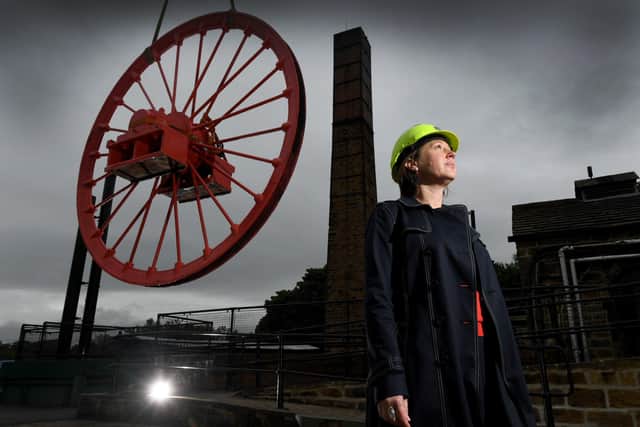 The newly restored pit wheel is put into place at the National Mining Museum, Wakefield. Pictures by Simon Hulme