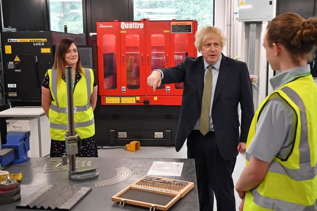 Prime minister Boris Johnson talks to construction apprentices in Dudley.