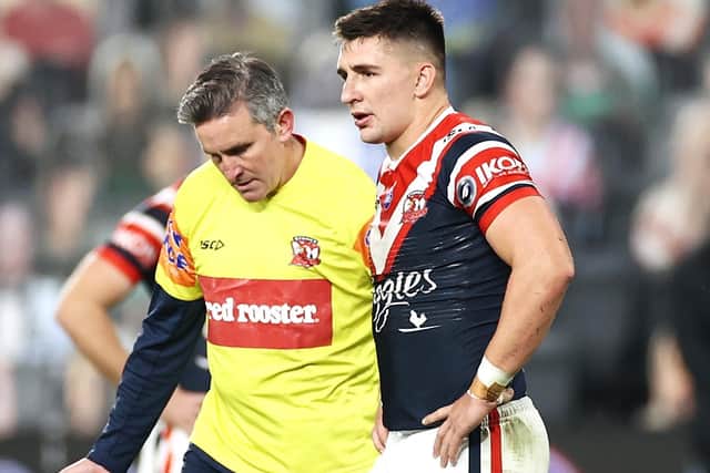 Victor Radley of the Roosters leaves the field with the trainer during the round seven NRL match between the Sydney Roosters and the St George Illawarra Dragons at Bankwest Stadium on June 26, 2020 in Sydney, Australia. (Picture: Cameron Spencer/Getty Images)