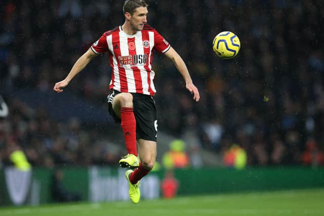 Chris Basham of Sheffield United leaps up to control the ball at the Tottenham Hotspur Stadium back in November (Picture: James Wilson/Sportimage)