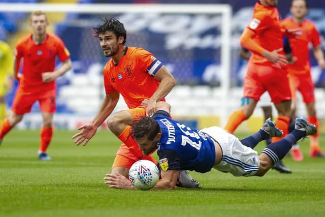 Terriers captain Chris Schindler and Blues' Lukas Jutkiewicz tangle. (Picture: Tony Johnson)