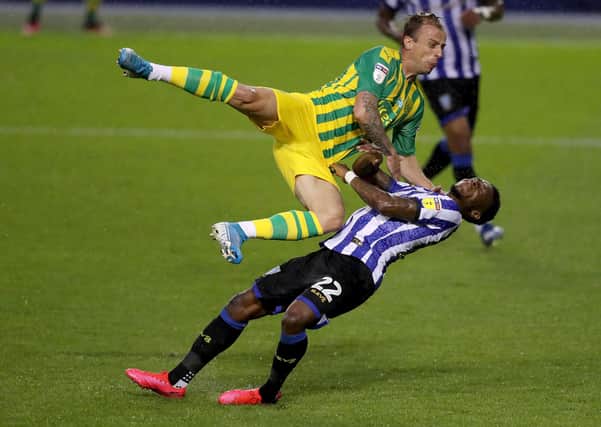 Kamil Grosicki of West Bromwich Albion stopped bt Moses Odubajo of Sheffield Wednesday (Picture: David Rogers/Getty Images)