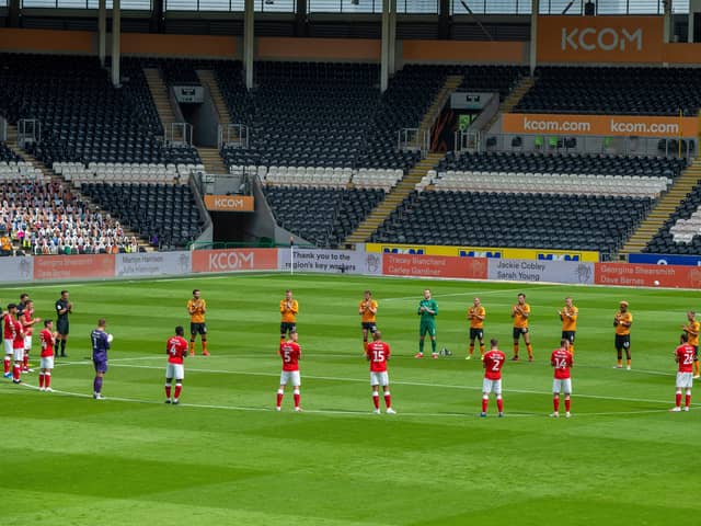 Tribute: Players giving one minute's applause for NHS staff before Hull City v Charlton Athletic. Picture: Bruce Rollinson