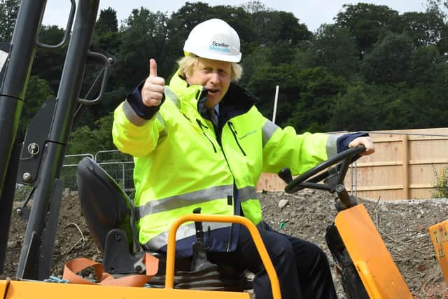 Prime Minister Boris Johnson during a visit to the Speller Metcalfe's building site at The Dudley Institute of Technology. Mr Johnson is expected to announce a multi-billion pound "new deal" for infrastructure projects to help stimulate the nation's recovery from the coronavirus pandemic.