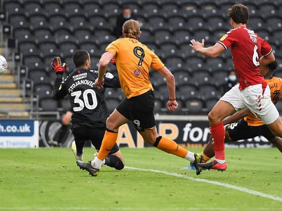Hull City's Mallik Wilks, far right, fires the ball past Middlesbrough goalkeeper Dejan Stojanovic to put his side 2-1 up at the KCOM Stadium. Picture: Getty Images