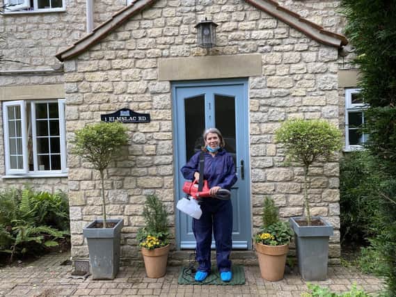 Helen Reid with her fogging machine outside Castle View, her holiday let in Helmsley