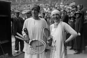 6th July 1925:  British tennis player Joan Fry (left) and France's Suzanne Lenglen on the court before the women's singles final at the Wimbledon Lawn Tennis Championships, which Lenglen won.  (Photo by E. Bacon/Topical Press Agency/Getty Images)