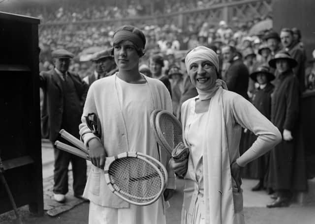 6th July 1925:  British tennis player Joan Fry (left) and France's Suzanne Lenglen on the court before the women's singles final at the Wimbledon Lawn Tennis Championships, which Lenglen won.  (Photo by E. Bacon/Topical Press Agency/Getty Images)