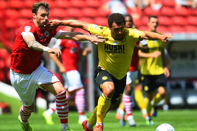 Barnsley's Michael Sollbauer tracks Millwall's Mason Bennett as the Reds kept another clean sheet. (
Picture: Jonathan Gawthorpe)