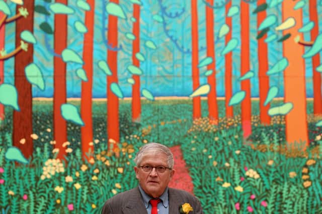 David Hockney pictured in 2011 with his painting The Arrival of Spring in Woldgate. (Getty Images).