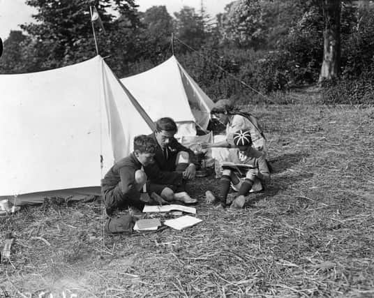 June 1922:  A family enjoy a camping holiday.  (Photo by Topical Press Agency/Getty Images)