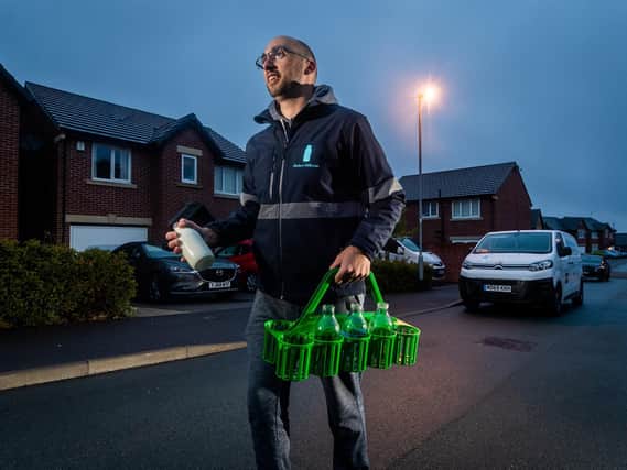 Milkman Andy Walker, aged 33, on his rounds in Pudsey, Leeds, delivering milk and Veg boxes for the Modern Milkman. Picture: James Hardisty